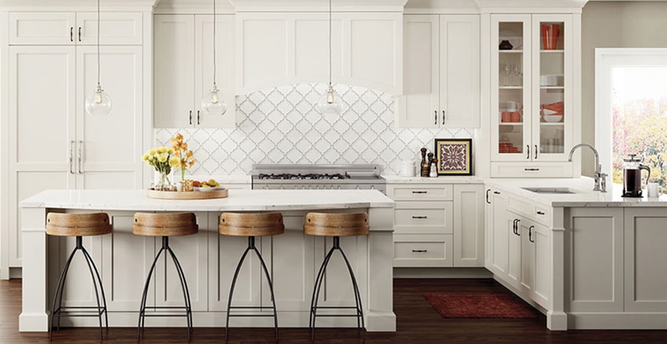 Image shows bright white custom woodland cabinetry in a modern, bright kitchen